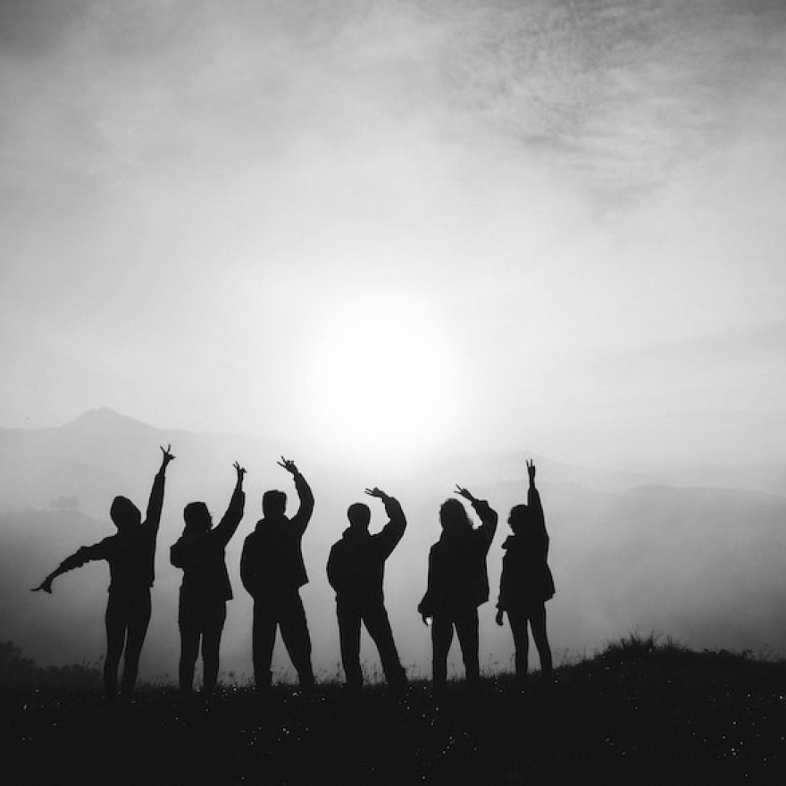 A silhouette of a group of people